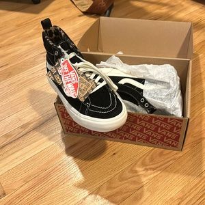 Vans hi tops with leopard interior.